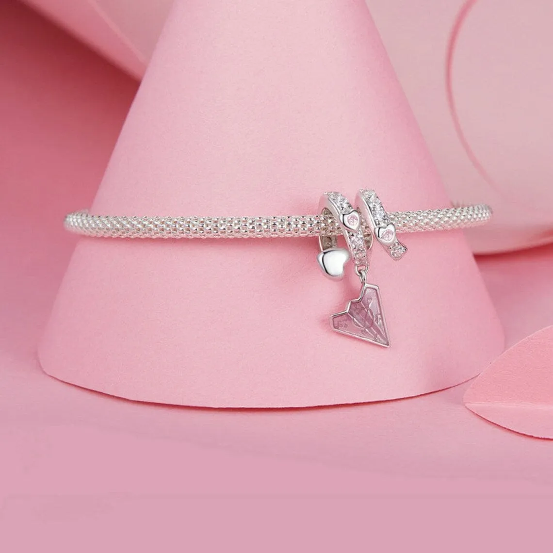 Crystal-Studded Heart Spiral with Pink Paper Plane Charm