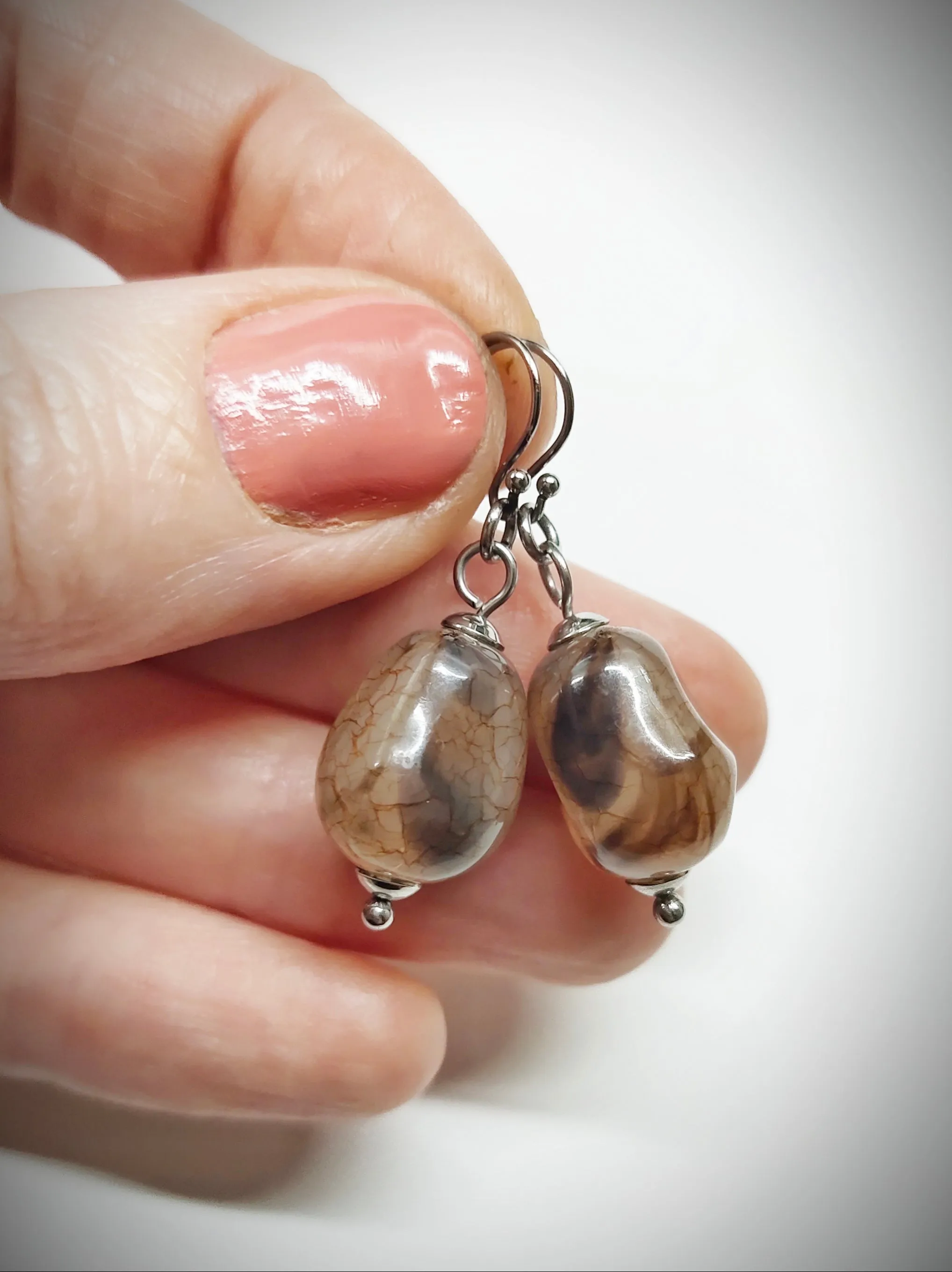 Matching greyish brown bead earrings for mother and daughter