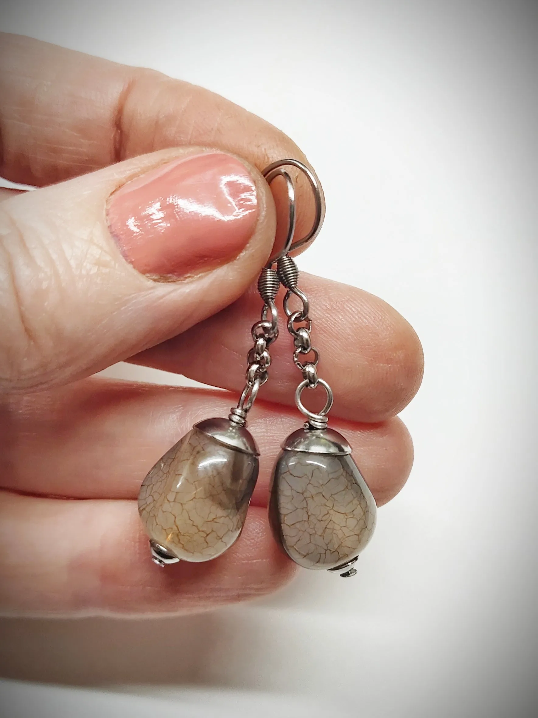Matching greyish brown bead earrings for mother and daughter
