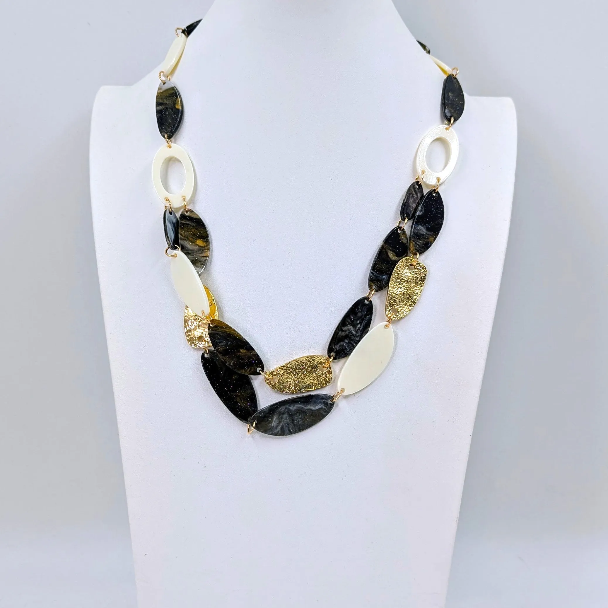 Organic resin shapes with metal components and 2 strand section necklace