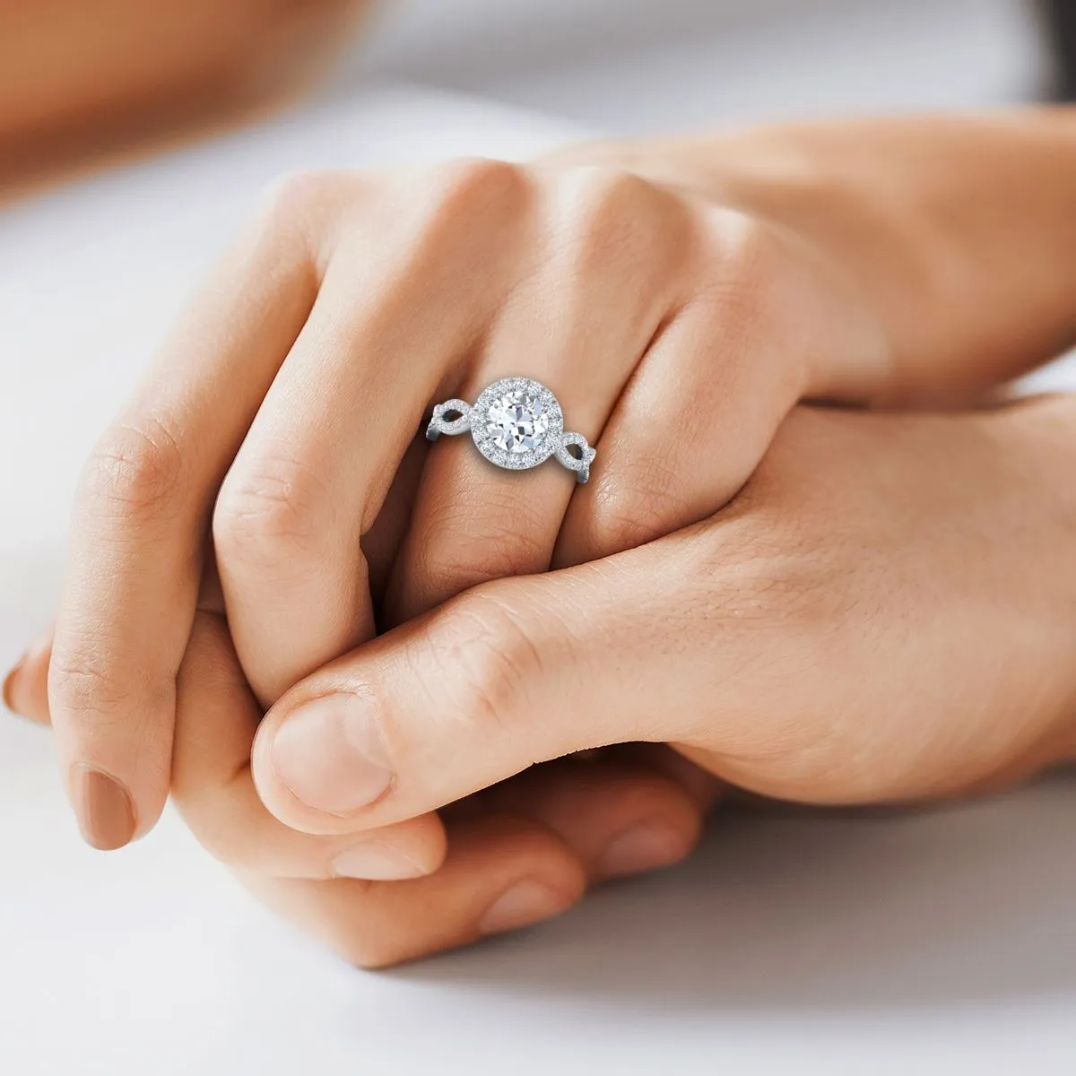 Platinum Round Brilliant Diamond Ribbon Twist French Pave Halo Engagement Ring -3/4ctw