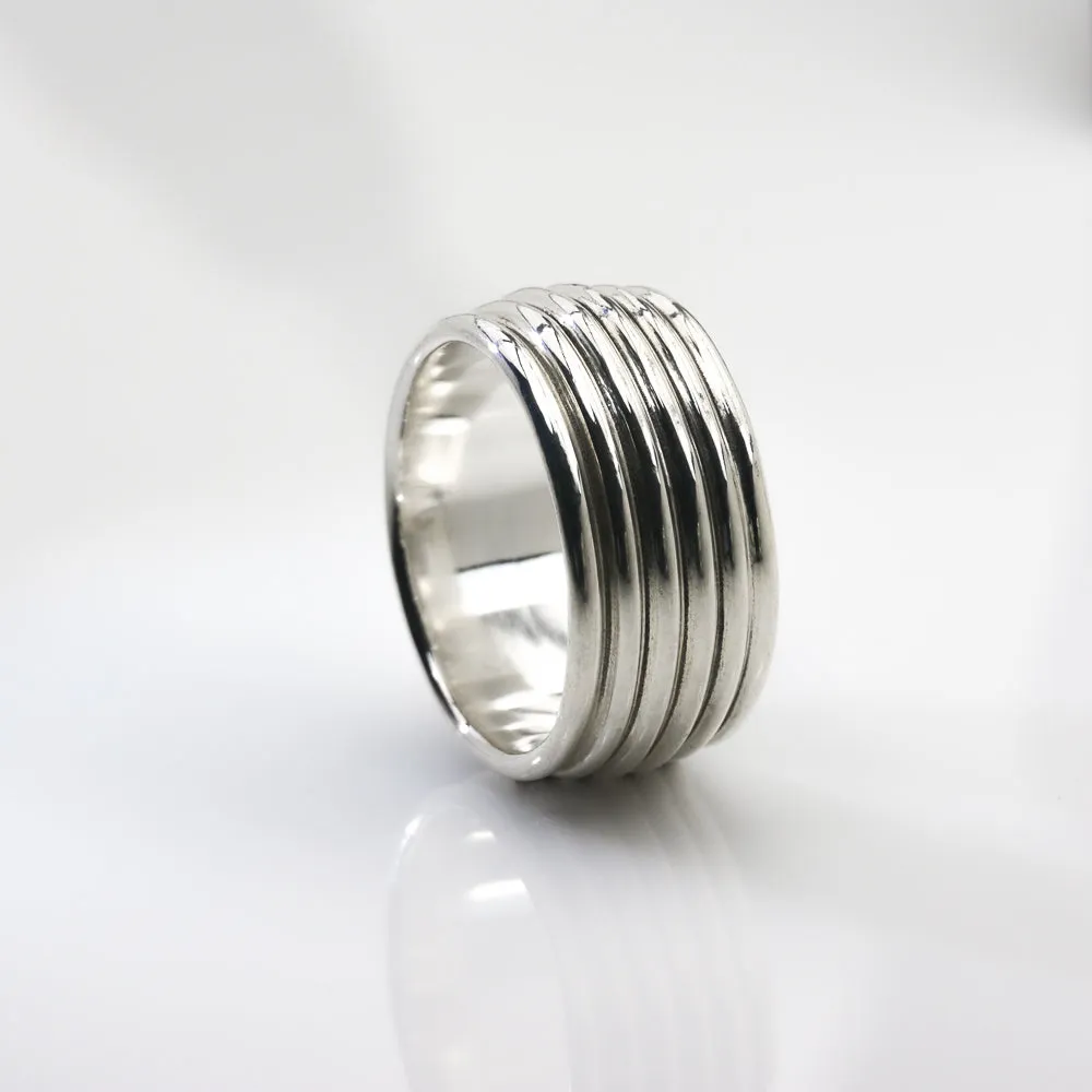 Revolutions: A Bold and Elegant Sterling Silver Ring with Six Loops