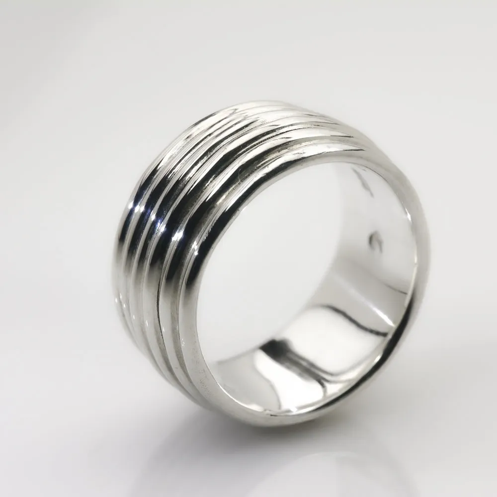 Revolutions: A Bold and Elegant Sterling Silver Ring with Six Loops